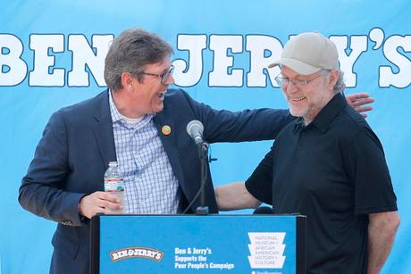 Ben & Jerry’s CEO Jostein Solheim welcomes Co-Founder Jerry Greenfield at the opening of an exhibit on the 1968 Poor People’s Campaign at the company’s Vermont ice cream factory.