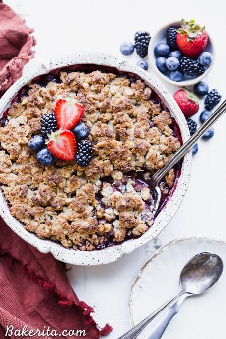 This Mixed Berry Crisp uses a mix of your favorite berries and is topped with a crunchy oatmeal crisp topping. This flavorful dessert is gluten-free, vegan, and best served with some dairy-free ice cream or coconut whipped cream!