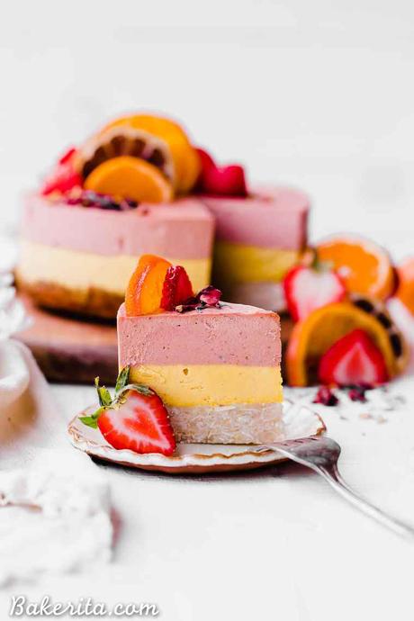 This Strawberry Orange Cheesecake with Coconut Crust is not just beautiful, but it's bright in flavor and absolutely delicious! The lemony coconut macaroon crust is perfect with the strawberry and orange flavors. You're going to adore this gluten-free, paleo and vegan cheesecake. 