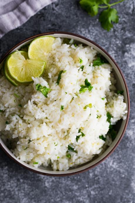 cilantro lime rice in brown bowl on gray background