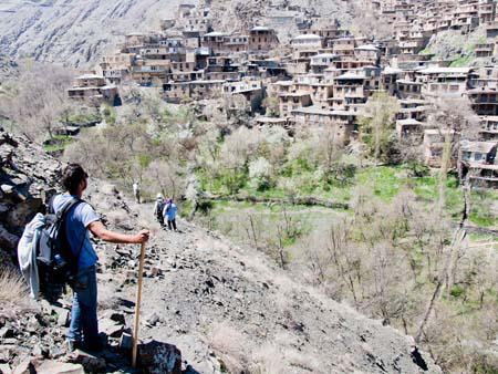 Travis climbing the hill overlooking Kang village