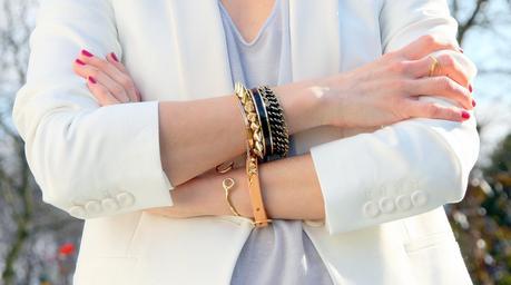 The white blazer and gold bracelets