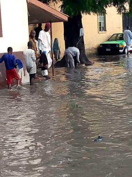 OMG! Residents Pose For Pictures Inside Dirty Water After Heavy Flood In Maiduguri (Photos)