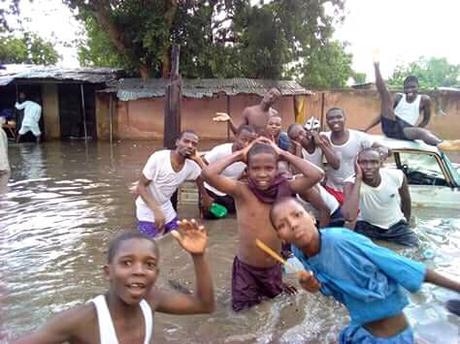 OMG! Residents Pose For Pictures Inside Dirty Water After Heavy Flood In Maiduguri (Photos)