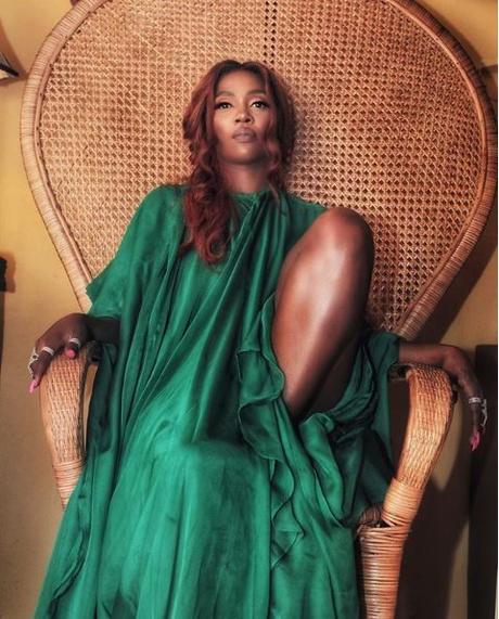 PHOTOS: Tiwa Savage Stuns Fans With Sultry Poses In Plunging Green Dress