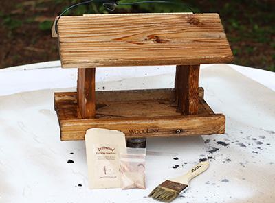 weathered wood bird feeder and stand