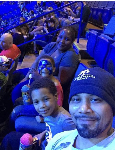 Army National Guard veteran Jason Bowden and his family gather during Marvel Universe Live