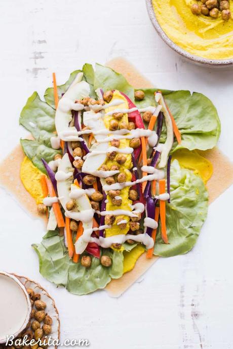 These Roasted Chickpea Veggie Wraps are a delicious gluten-free and vegan lunch or dinner that you can make ahead of time. They have a wonderful Turmeric Hummus spread inside and a Tahini Dressing/Dipping Sauce to serve with!