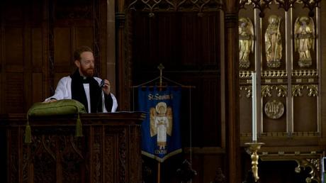 the priest nods his head to Hadaway during his church sermon at st saviours in the wirral