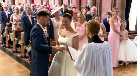 the wedding videographer Love gets sweeter captures the moment the groom places the wedding ring on the brides hand at their wirral wedding