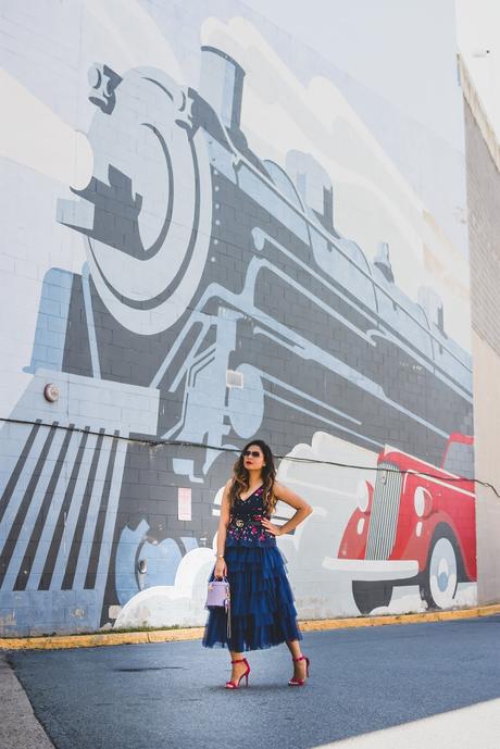 j crew embroidered peplum top, tule skirt asos, navy blue monochromatic outfit, street style, party look, studded sandals, bright pink lips, bucket bag, purple bag, myriad musings 