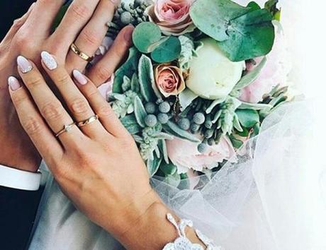 12 month wedding planning timeline hands couple married