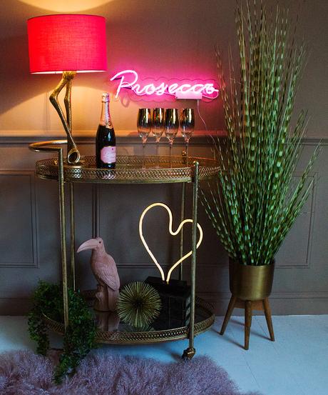 How to style a drinks trolley. Pink neon lights.