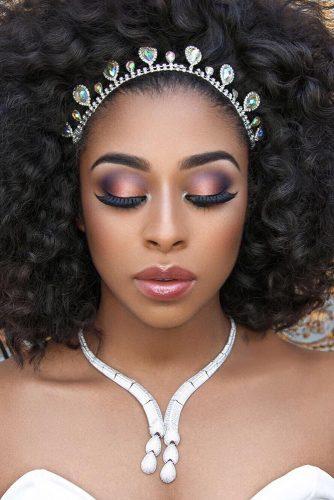 black bride makeup with long lashes peach and lilac eyeshadows joyadenuga