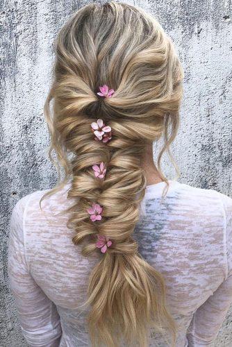 wedding hairstyles for long hair cascading braid with pink flowers in hair hairbyalexrae via instagram