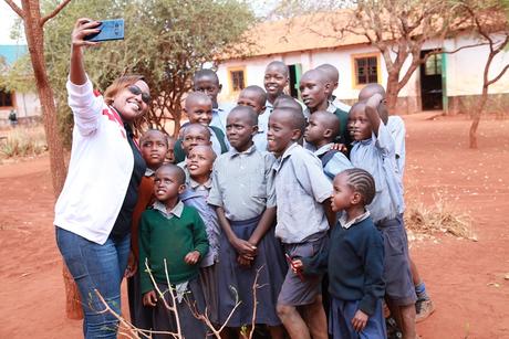 Airtelâs Marion Wambua takes a selfie with the pupils at St. Michael Matulani Primary School.