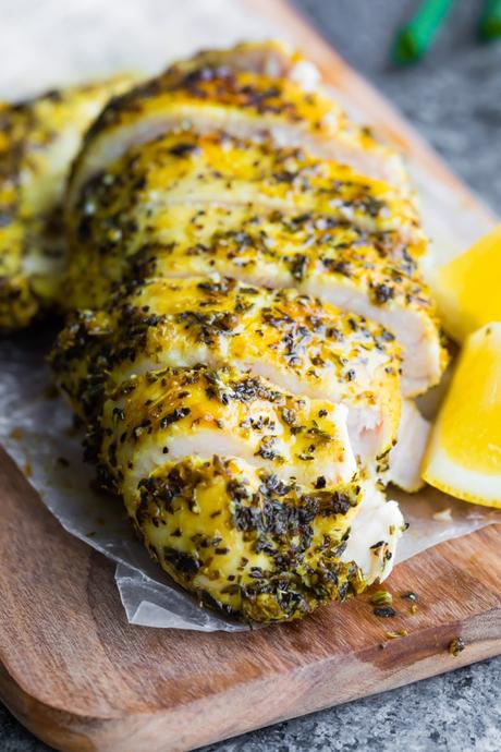 baked lemon pepper chicken on a cutting board