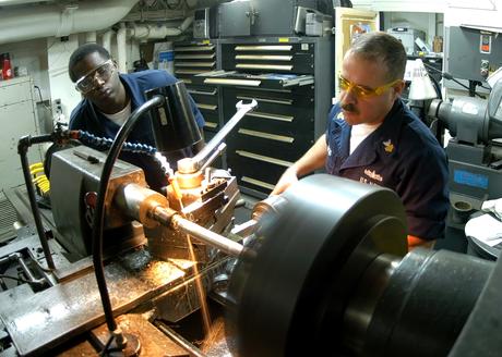 090203-N-2636M-054 ATLANTIC OCEAN (February 3, 2009) Machinery Repairman 1st Class Ruben Arocho, from Puerto Rico, and Machinery Repairman Fireman Anthony Harris, from Chicago, manufacture a shaft on a lathe aboard the multi-purpose amphibious assault ship USS Bataan (LHD 5). Bataan is conducting composite unit training exercise (COMPTUEX) to prepare for a scheduled deployment later this year. (U.S. Navy photo by Mass Communication Specialist 3rd Class Kleynia R. McKnight/Released)