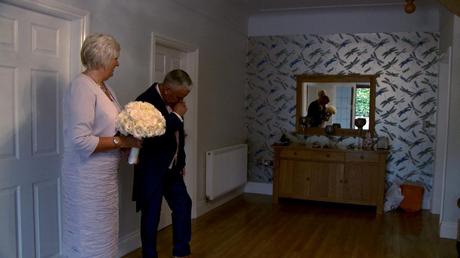 the dad fights happy tears as he sees his daughter for the first time in her wedding dress at their home in Prenton