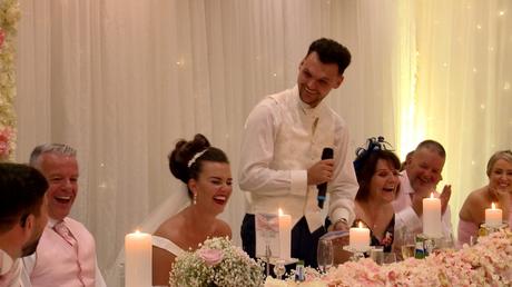 The groom makes the top table laugh out loud during his thornton hall wedding speech
