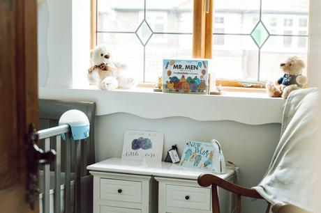 A shot that looks like we've peeked in to a little boys nursery room at home with his Mr Men collection and blue, grey and white themed decor