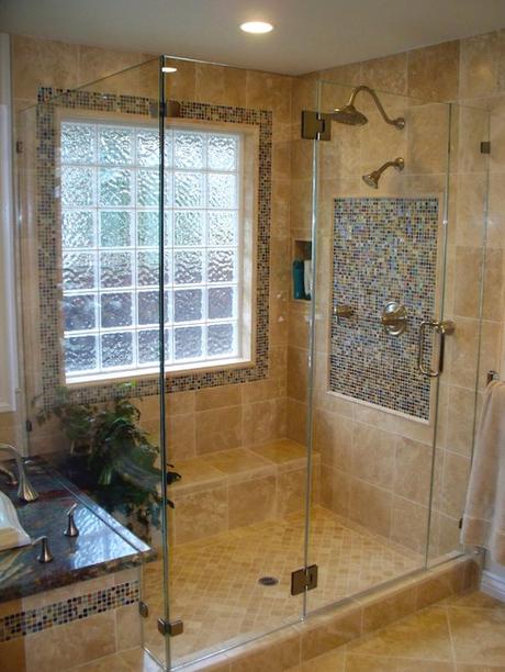 Mediterranean style bathroom with glass block privacy window