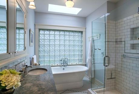 glass block tiles next to bathtub with natural light 