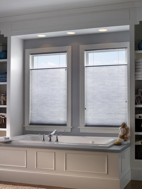 natural light bathroom with closed white shades