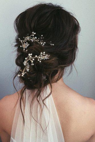 wedding hairstyles 2019 messy low updo with pearl accessorie and veil caraclynebridal