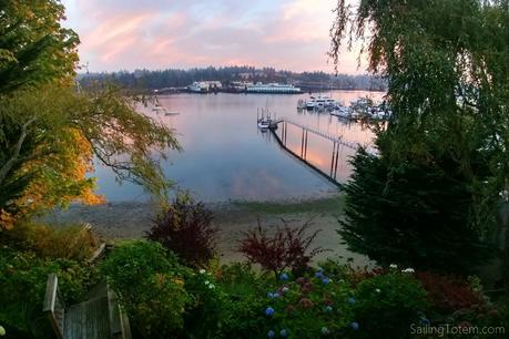 pink sunrise reflects on still water in a tranquil pacific northwest bay