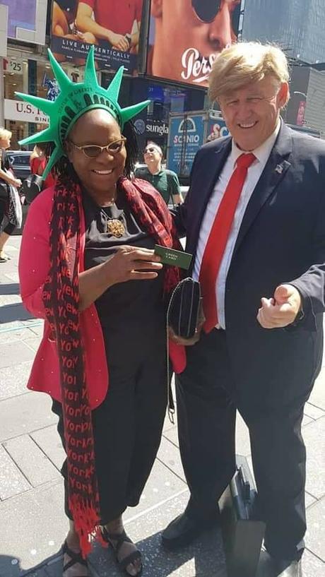 Fayose’s Mom Pictured With Donald Trump’s Lookalike In US As She Celebrates Birthday
