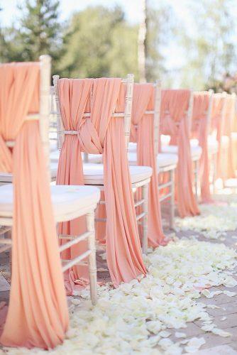 coral wedding decorations chair in aisle Sonya Khegay Photography