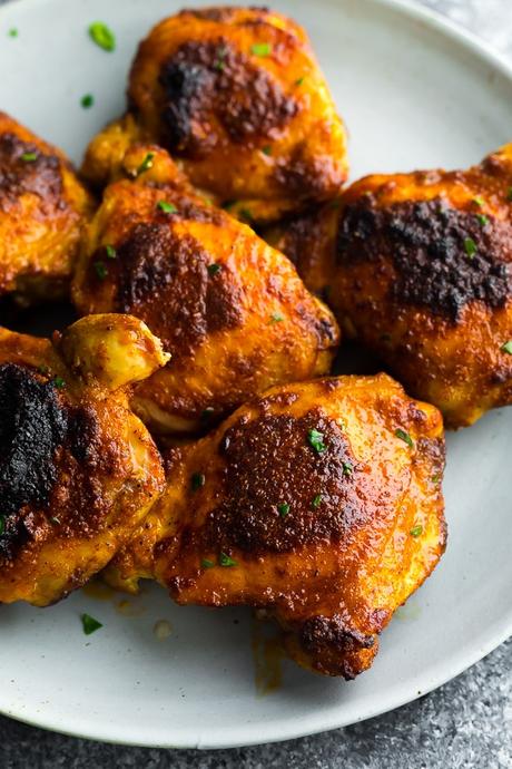 a plate filled with perfect baked chicken thighs