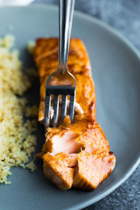 fork flaking the salmon cooked with balsamic salmon marinade