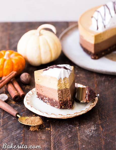 This No Bake Layered Chocolate Pumpkin Cheesecake has layers of chocolate cashew cheesecake and pumpkin spice cheesecake, on top of a chocolate date crust. This make-ahead raw dessert is perfect for the holidays.