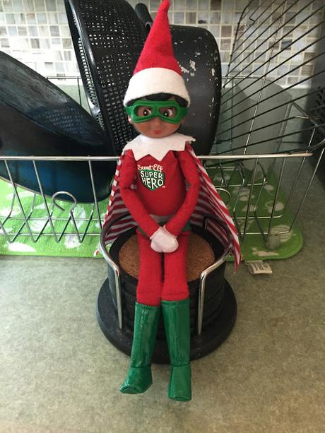 An elf doll dressed as a super hero