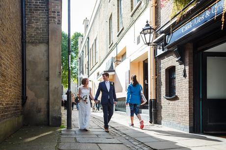 Trafalgar Tavern Wedding | Susie and Steve bride and groom walking through the streets of greenwich