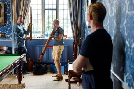Hengrave Hall Wedding Photography | Alice and Nick the boys play with didgeridoos