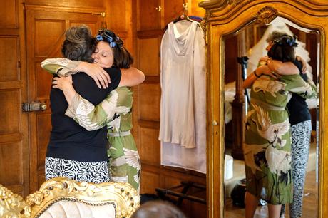 Hengrave Hall Wedding Photography | Alice and Nick the bride hugs her mother