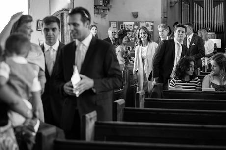 guests arrive at an old buckenham church wedding
