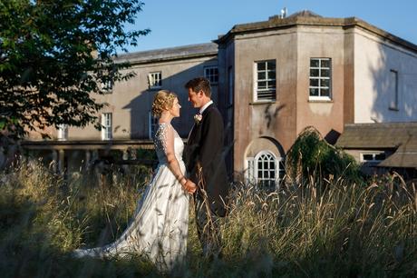 bride and groom wedding photos in front of pennard house