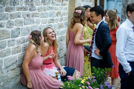 guests laugh outside the coach house