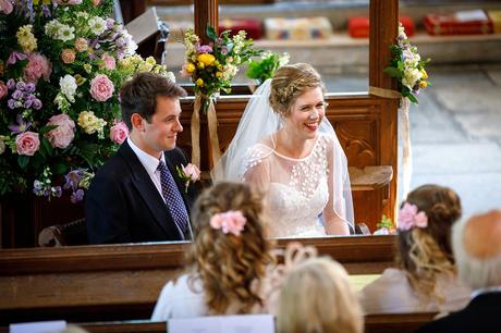 michelle and george smile during their wedding ceremony at pennard house
