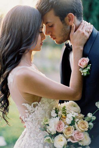 besame wedding styled shoot romantic photography bride with dark loose curls and bouquet groom with boutonniere carrie king photographer