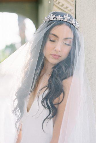 besame wedding styled shoot bride with dark loose curls under the veil and silver crown carrie king photographer
