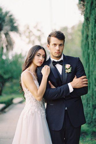 besame wedding styled shoot romantic photography bride with dark loose curls and groom with boutonniere carrie king photographer