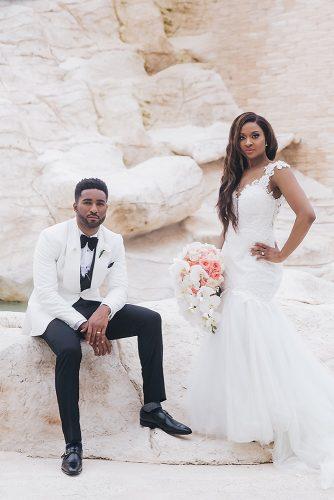 real wedding photography cindy glen bride with white cascading orchid bouquet and groom in black white suit stanlo photography