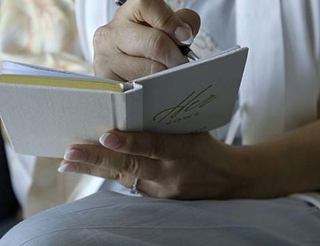 wedding vows for her bride holds vow book