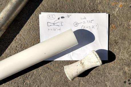 Plastic stock for future anchor roller, plans sketched on paper, and beat up old roller.