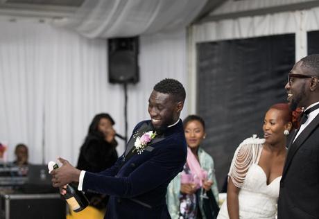 Photos of Sauti Sol’s Polycarp Otieno exchanging vows with his Burundian sweetheart in a white wedding